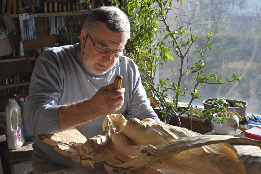 artist sculptor working angel workshop sunlight